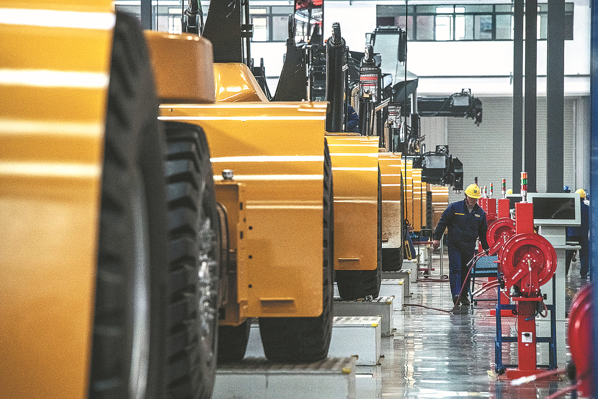 An employee works at Xuzhou XCMG Port Machinery plant in Xuzhou