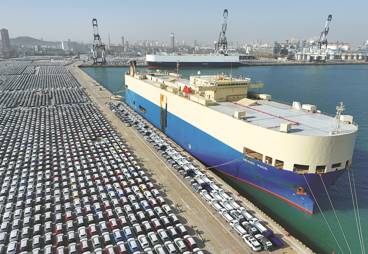 Export-bound vehicles await loading in Yantai Port